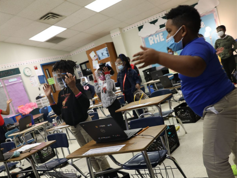 Elementary school students in class participating in Move This World experiences